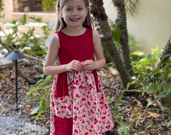 pink dress with cherries