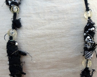 shell bead necklace with black and gold sahri thread Intertwined hematite