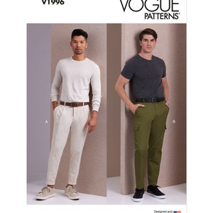 May include: Two men's fashion illustrations showing two different styles of pants. The man on the left is wearing a white sweater and white pants with a brown belt. The man on the right is wearing a gray t-shirt and green cargo pants with a black belt. Both men are wearing black sneakers. The text "V1996" is in the top left corner of the image. The text "VOGUE PATTERNS" is in the top right corner of the image. The text "Designed and printed in the USA" is in the bottom right corner of the image.