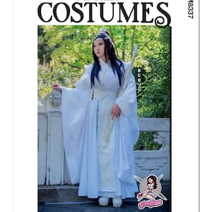 May include: A white costume with long sleeves and a sash. The costume is worn by a person with long black hair and a headband. The person is standing in a garden setting. The image is from McCall's Costumes and the pattern number is M8337.