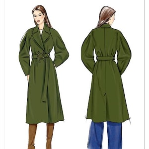 May include: Vogue Patterns V2137. Illustration of a green trench coat with a double-breasted design, belted waist, and long sleeves. The image shows both front and back views of the coat. The text "VOGUE PATTERNS" is at the top.