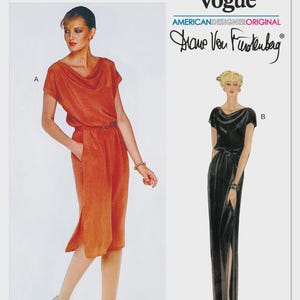 May include: A Very Easy Vogue sewing pattern V2191 by Diane Von Furstenberg. The package displays two dress variations: a knee-length rust-colored dress with a cowl neckline and side slits, and a floor-length black dress with a similar silhouette.