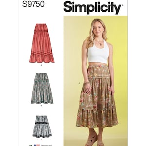 May include: Simplicity sewing pattern S9750 for a tiered skirt. The pattern includes three different skirt styles: a solid red skirt, a floral print skirt, and a black and white patterned skirt. The pattern is designed and printed in the USA.