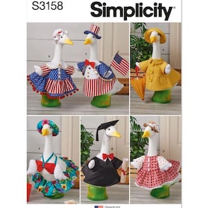 May include: Simplicity pattern S3158 featuring goose figurines dressed in various outfits. The geese wear patriotic attire, a graduation gown, and a yellow raincoat. The image includes the text "Simplicity" and "Designed and printed in USA."