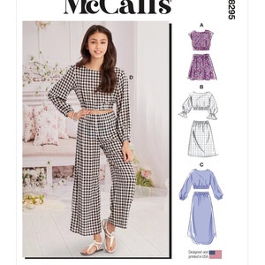 May include: McCall's sewing pattern M8295 for a gingham crop top and wide-leg pants. The pattern includes three different variations for the top and bottom pieces.