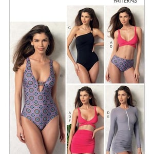 May include: Vogue Patterns V9192 sewing pattern envelope featuring five swimwear designs: a patterned one-piece with a deep neckline, a black one-shoulder one-piece, a pink bikini with patterned bottoms, a pink bikini with a skirt, and a gray long-sleeve suit.