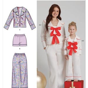 May include: Simplicity pattern S3202. The image shows a pajama pattern with three variations: a floral print pajama set, a solid pink shorts set, and a solid white pajama set with red bow accents. The pattern includes a mother and daughter wearing the white pajama set.