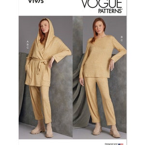 May include: Vogue Patterns V1975 sewing pattern for a hooded robe, long-sleeved top, and pants. The pattern is shown in a light brown color.