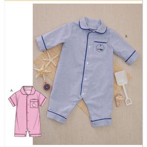 May include: Butterick sewing pattern B7067 featuring baby pajamas. The main image shows a blue and white striped romper with a sailboat emblem. A smaller image shows a pink gingham romper. The pattern is designed and printed in the USA.