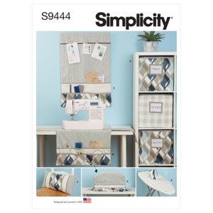 May include: Simplicity sewing pattern S9444 for a sewing room organizer. The pattern includes instructions for making a wall organizer, a sewing machine cover, a pillow, and storage boxes. The wall organizer has pockets for storing fabric, patterns, and other sewing supplies. The sewing machine cover is designed to protect a sewing machine from dust and dirt. The pillow is a decorative accent for a sewing room. The storage boxes are perfect for organizing sewing supplies.