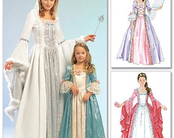 May include: Three women wearing princess costumes. The woman on the left is wearing a white gown with a silver bodice and a white fur trim. The woman in the middle is wearing a blue and white gown with a white bodice. The woman on the right is wearing a pink and white gown with a purple bodice.