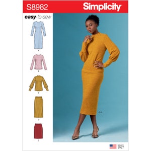 May include: Simplicity sewing pattern S8982. The image shows a woman wearing a mustard-colored knit top with puffed sleeves and a matching pencil skirt. The pattern also includes illustrations of other garment options, including a dress and a pink long-sleeved top.