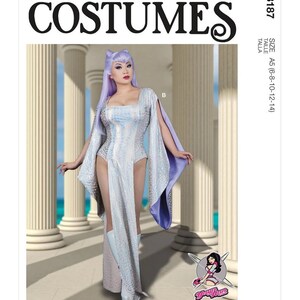 May include: McCall's Costumes pattern featuring a futuristic silver and white bodysuit with cape sleeves and a high slit. The model wears a lavender wig and white boots. The pattern includes size A5 (6-8-10-12-14).