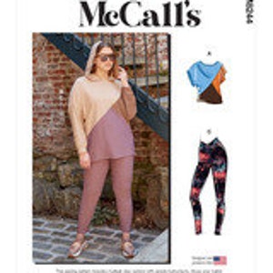 May include: A woman is wearing a two-toned knit top with a long sleeve and a pair of matching knit pants. The top is a light brown color on the left side and a darker pink color on the right side. The pants are a solid darker pink color. The woman is wearing sandals and sunglasses. The image also shows two separate images of clothing items. The first image shows a blue and brown color-blocked t-shirt with short sleeves. The second image shows a pair of black leggings with a floral print.