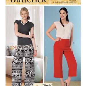 May include: Butterick sewing pattern B6851 featuring two different pant styles. One model wears wide-leg pants with a black and white geometric pattern. The other model wears red culottes. The pattern includes sizes A (6-8-10-12-14-16-18-20-22).