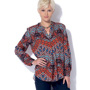 May include: A long-sleeved, red, blue, and black patterned blouse with a V-neck and a high-low hemline.