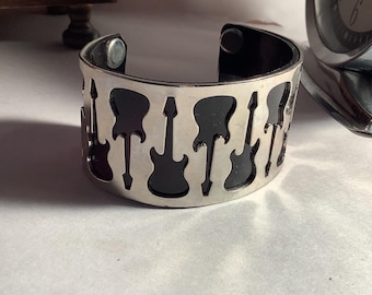 80’s /90’s Cuff Bracelet, Multi Cutouts of a Fender Stratocaster Guitar Cuff Bracelet