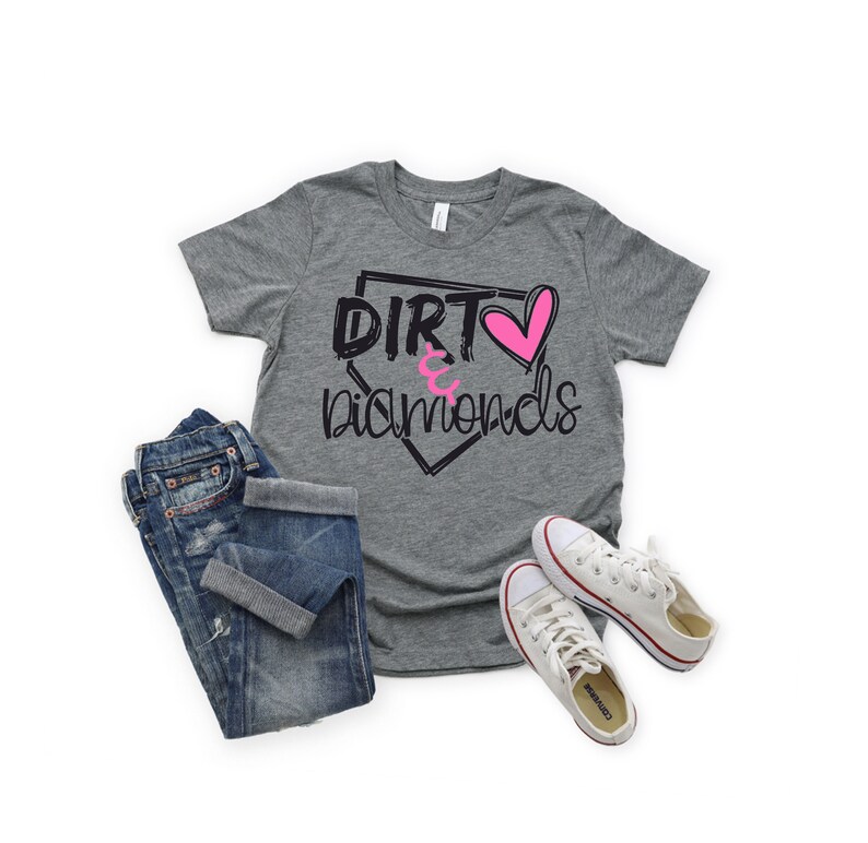 May include: A gray t-shirt with a baseball diamond graphic and the text "Dirt & Diamonds" in black with a pink heart.