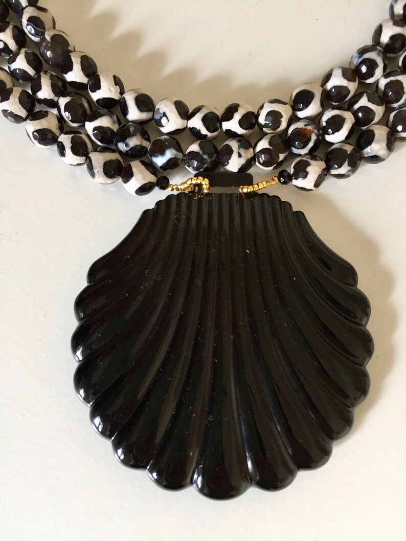 Black and white glass beads necklace with a vintage black enamel belt buckle
