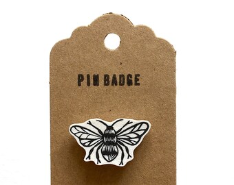 Bee pin badge.