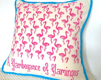 Pink flamingo cushion cover. Handprinted linocut design with the collective noun "A flamboyance of flamingoes" 35x35cm (14"x14")