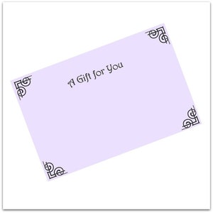 May include: A rectangular light purple gift card featuring the black text A Gift for You centered on the front. The card is decorated with black ornamental scrollwork designs located in each of the four corners of the rectangular surface.