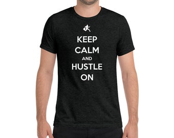 Keep Calm and Hustle On in this premium tri-blend t-shirt for entrepreneurs and hard workers everywhere