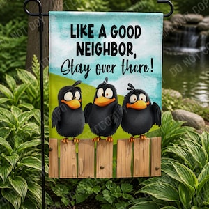 May include: A garden flag featuring three cartoon crows perched on a wooden fence. The flag has a blue sky background with the text "LIKE A GOOD NEIGHBOR, Stay over there!" printed in black.