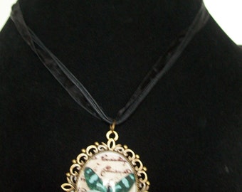 Butterfly glass cabochon necklace