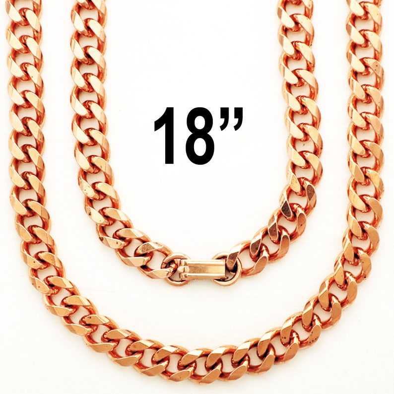 May include: An 18 inch copper chain necklace with a curb link style. The chain is made of copper and has a shiny finish.