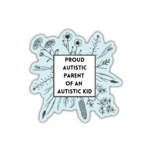 May include: A light blue sticker with a black outline of flowers and a white box with the text "PROUD AUTISTIC PARENT OF AN AUTISTIC KID".