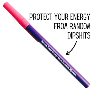 May include: A pink and purple pen with the text "Protect Your Energy from Random Dipshits" printed on it.