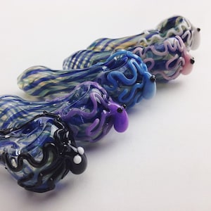 May include: Five glass pipes with colorful swirls and octopus-like designs. Each pipe has a different color scheme, including blue, purple, pink, and white.