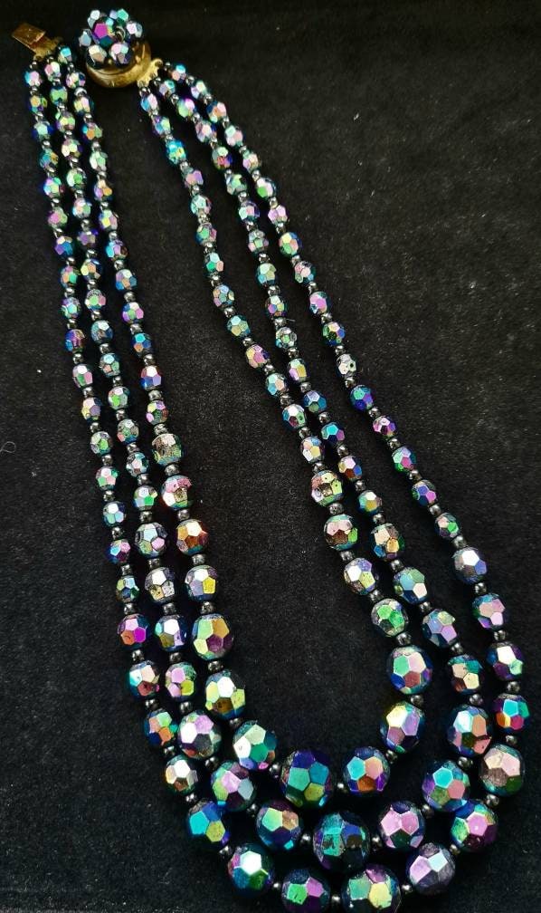 Chezch Glass, black jet with AB coating. Triple strand 1950's graduated necklace with feature clasp. V19