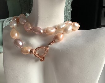 Multi colour freshwater cultured baroque pearls hand knotted on pink silk with 925 rose gold plated sterling silver clasp and components