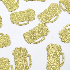 Beer mug shaped confetti pieces in gold glitter.