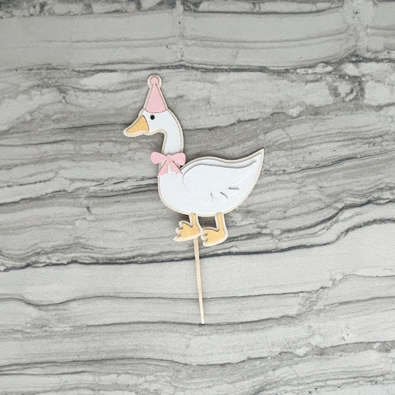 Goose cupcake topper shown in light pink accent color.
