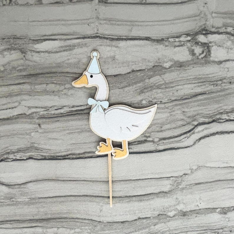Goose cupcake topper shown in light blue accent color.