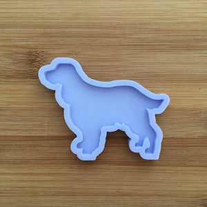 May include: A light purple silicone mould shaped like a dog. The mould is designed for making resin crafts.