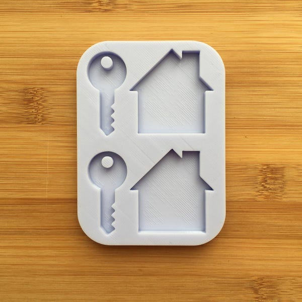 Molde de silicone com silhueta de chave e casa