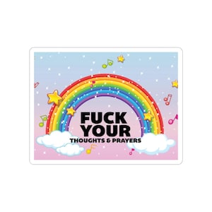 May include: A sticker with a rainbow design and the text "FUCK YOUR THOUGHTS & PRAYERS". The sticker has a light blue and pink background with musical notes and stars.