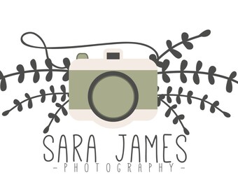 May include: A logo design featuring a vintage-style camera in muted green and cream colors, surrounded by dark green leafy sprigs. The name "SARA JAMES" is written below the camera in a whimsical font, with "- PHOTOGRAPHY -" underneath.