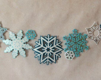 Glittered Snowflake Garland: 44" Winter Wonderland Party Decor