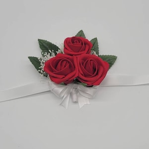 Red and White Wrist Corsage with Baby&#39;s Breath and Matching Boutonniere
