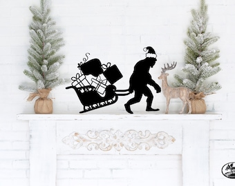 Metal Wall Art Sign, Christmas Santa Bigfoot Sasquatch Pulling Sleigh with Gifts Home Decor Family Gift Idea