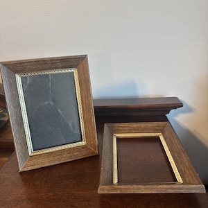 May include: A handmade wooden sign with the text "Welcome" in a playful font. The sign is painted white with a distressed finish, and features a small, decorative heart. Dimensions are approximately 12 inches wide and 6 inches tall.