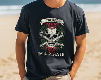May include: Navy blue t-shirt with a skull and crossbones graphic, roses, and the text "PRETEND I'M A PIRATE." The design is distressed for a vintage look. The shirt is short-sleeved.