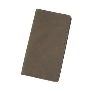 May include: A brown leather wallet with a stitched edge.