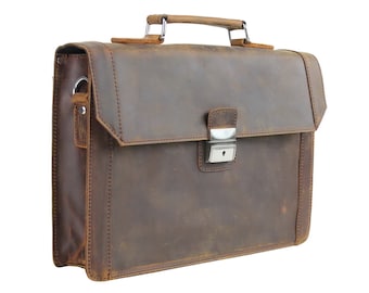 May include: A brown leather briefcase with a metal clasp and a handle. The briefcase has a worn, distressed look.