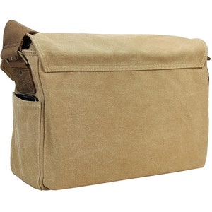 May include: A tan canvas messenger bag with a brown leather strap and a small pocket on the front.